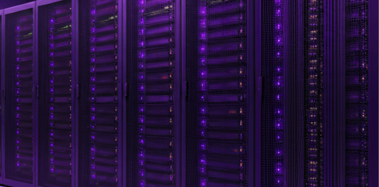 A row of data center server racks filled with stacked computer hardware, illuminated by glowing purple status lights.